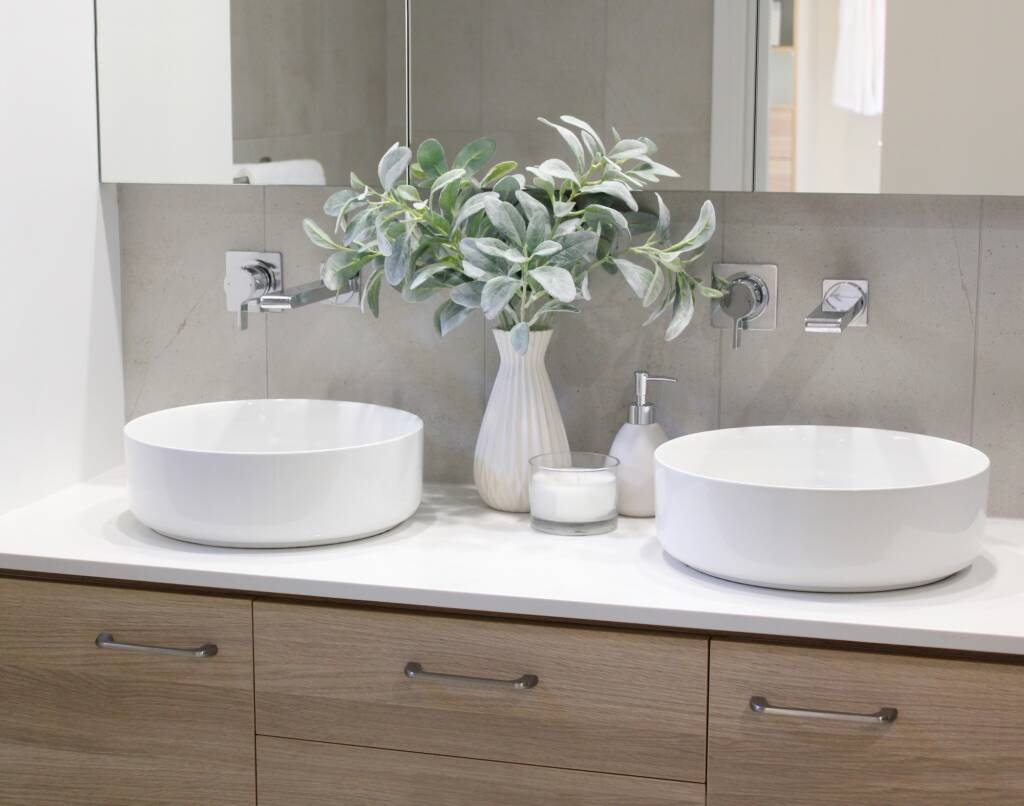 Twin circular hand washing basins in the bathroom vanity